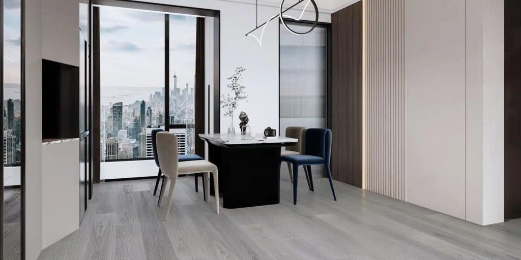 A modern office with light gray laminate flooring, a sleek table, and a view of the city skyline.