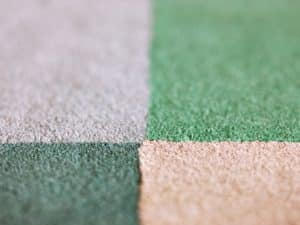 Close-up of multicolour texture after installing carpet tile on concrete in a patterned layout